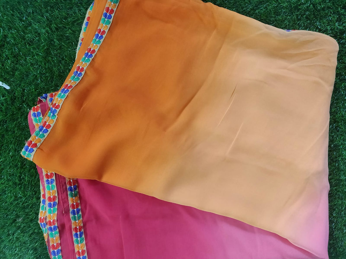 Orange shaded chiffon saree with Kutchi work Blouse