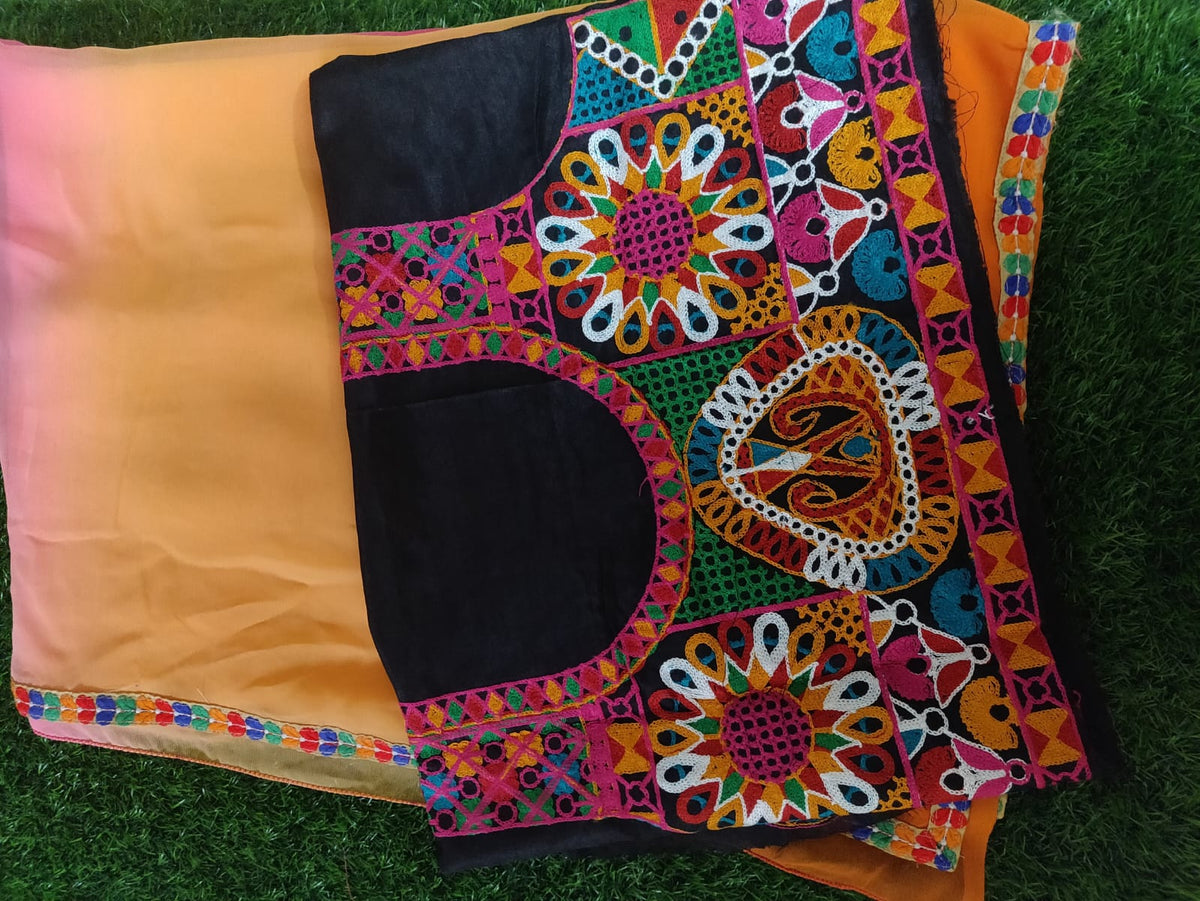 Orange shaded chiffon saree with Kutchi work Blouse